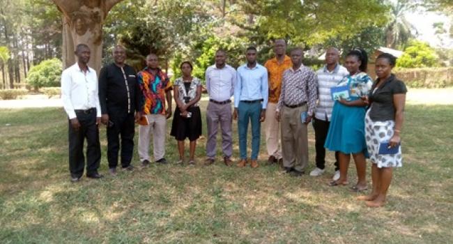 The District Team Posing for a Group Photo with Farm Radio Team after holding an Evaluation Meeting